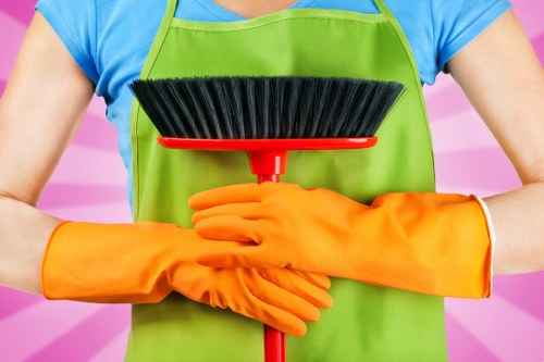 Cleaner working in a Brompton property with careful access considerations