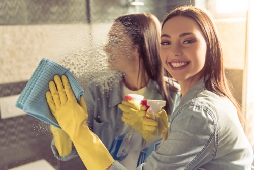Technician treating a mattress with specialist cleaning equipment