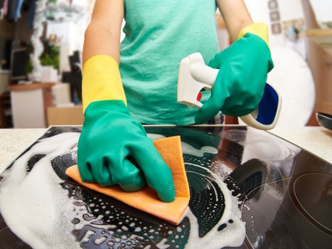 Cleaner maintaining a Brompton office kitchen and communal area